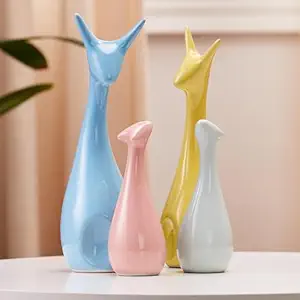 Amazon Basics Home Decor Happy Deer Family Action Statue Piano Finish Ceramic Figures(Set of 4,Multicolor)