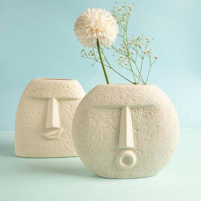 The White Space Set of Two Flying Kiss and Upbeat Face Ceramic Vase to add Personality to interiors with Minimalistic and Modern Raw Finish
