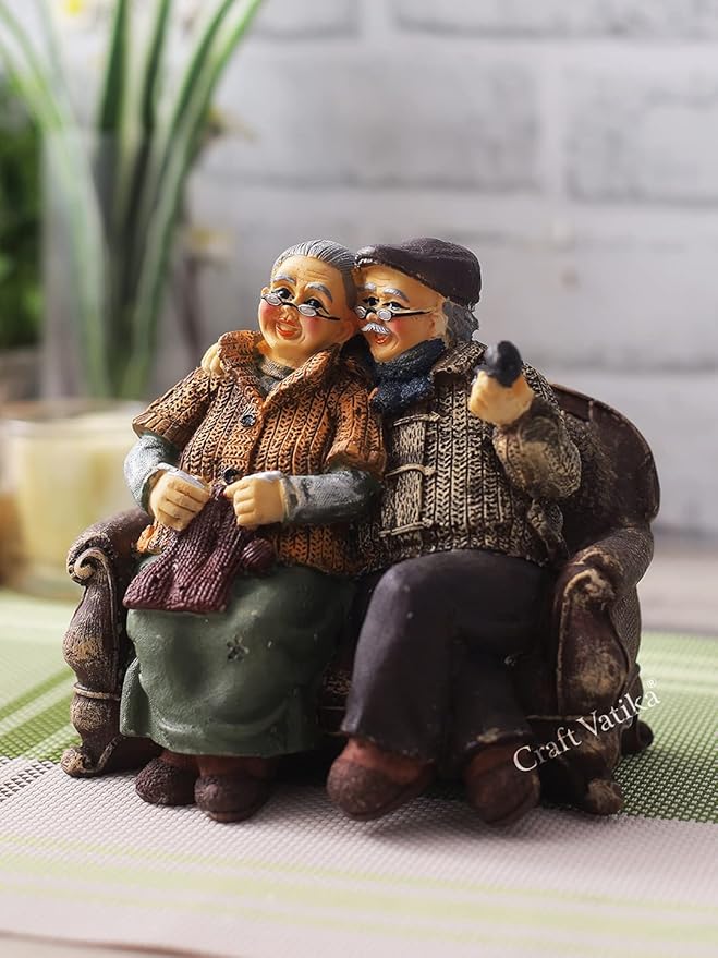 CraftVatika Dada Dadi Romantic Couple Miniatures Grand Parents on Sofa Statue Showpiece for Home Decor - Best Gift for Love, Valentine, Retirement Party, Wedding Anniversary, Multicolor, 14 x 8.9 cm